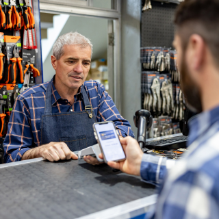Shopper making a payment in a auto store