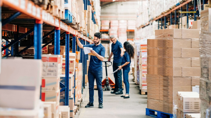 People in a warehouse looking at products